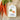 Packaged carrot fettuccine with a Valente Market label next to fresh carrots on a textured surface.