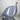 Ceramic bird figurine with blue and white pattern on a plain background