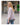 Woman wearing a striped shirt and jeans on a city street.