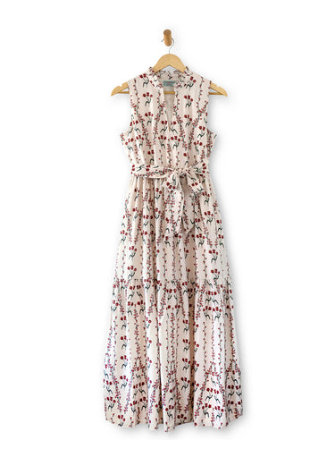 Floral dress on a hanger against a white background