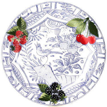 Decorative plate with blue floral and bird pattern, surrounded by strawberries, cherries, and blackberries.
