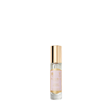 Small perfume bottle with gold cap on a white background