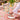 Pomegranate Wildflower Garden Collection Tablecloth shown on table with place setting Shown with napkins