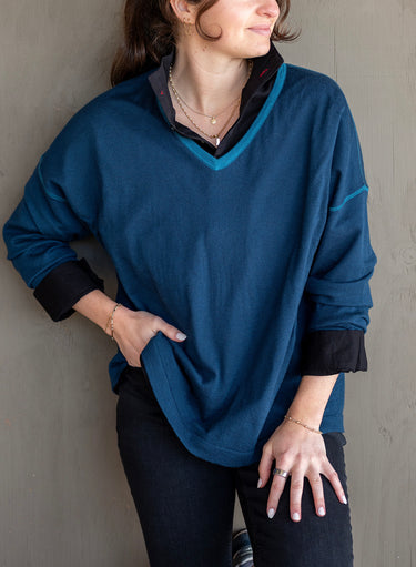 Delmar V-Neck Sweater in Deep Teal shown worn over a black collared shirt