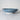 Ceramic bowl with blue floral pattern on a marble surface
