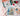Painting kit with sailboat painting, brushes, and flowers on a table