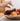 Pumpkin Patch Potpourri Shown in bowl with person adding more essential oils to the dried potpourri