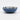Blue ceramic bowl with decorative patterns on a white background