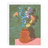 Card with floral design and text 'I love you in every lifetime' on a green background
