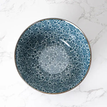 Blue patterned ceramic bowl on a marble surface