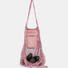 Pink mesh bag with avocadoes on a white background