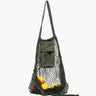 Green mesh bag with a small pouch containing lemons on a white background