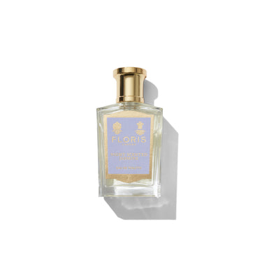 Perfume bottle with gold cap and 'Floris' label on a white background