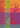 A colorful graphic print featuring stylized illustrations of spices and food elements like a pepper, cinnamon stick, chili pepper, and nutmeg, arranged in a grid of vertical color blocks including orange, green, pink, purple, and blue.