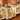 Garnier-Thiebaut ‘Delices D’Automne Potiron’ tablecloth Overlaid with table runner