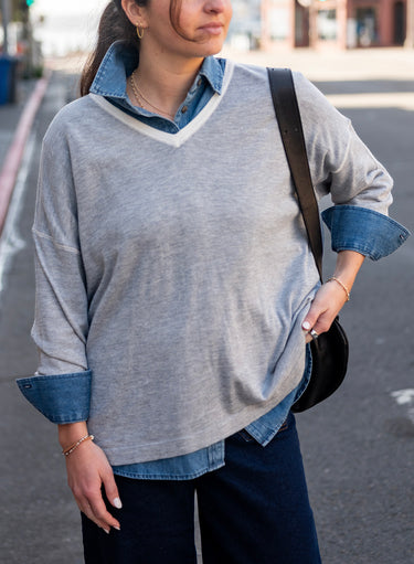 Delmar V-Neck Sweater in Silver Cloud worn over a chambray collared shirt