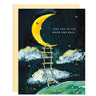 Love You To the Moon & Back card features drawn image of a crescent moon with sleeping face with a rope ladder down to earth. There is a black background with stars and a few clouds.