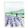 Congratulations On your wedding card features a drawn image of a couple walking amongst lavender fields and green rolling hills. The message on the front reads simply, ‘Congratulations”