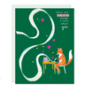 A charming love card featuring an adorable fox perched at a writing desk, pen in hand, crafting an endless swirly list of reasons why they're in love.