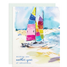 Two colorful spinnakers with varied sail hues grace a serene shoreline, capturing the spirit of exploration and new beginnings. Perfect for birthdays or anniversaries
