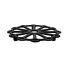 Black cast iron trivet on a white background