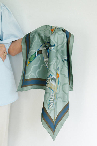 Duck Silk Scarf Features four ducks in flight with a bold striped border