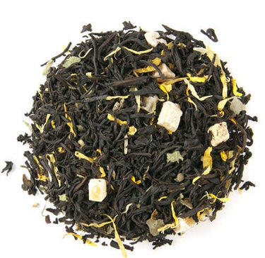 Tea leaves with visible stems and herbs on a white background